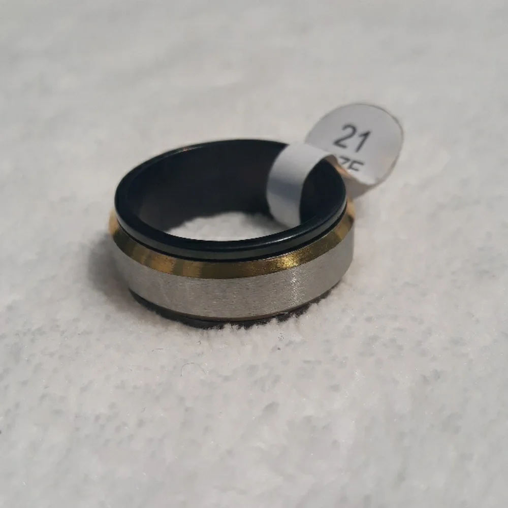 Gold, silver, and black men's spinner ring size 11.5